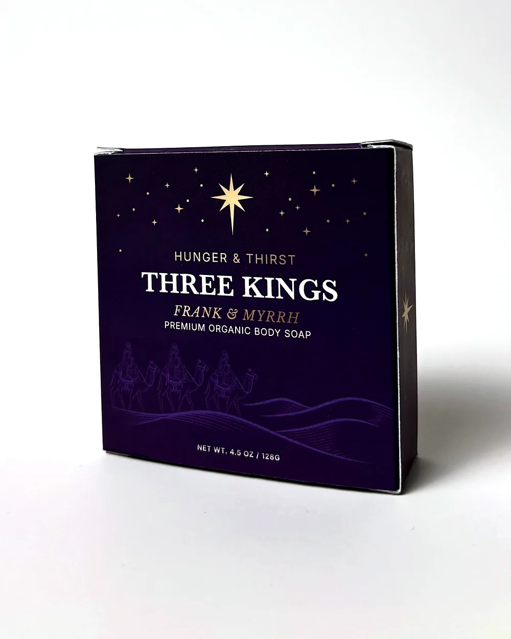 Three Kings soap box, front, deep purple with a gold star and three kings on camels